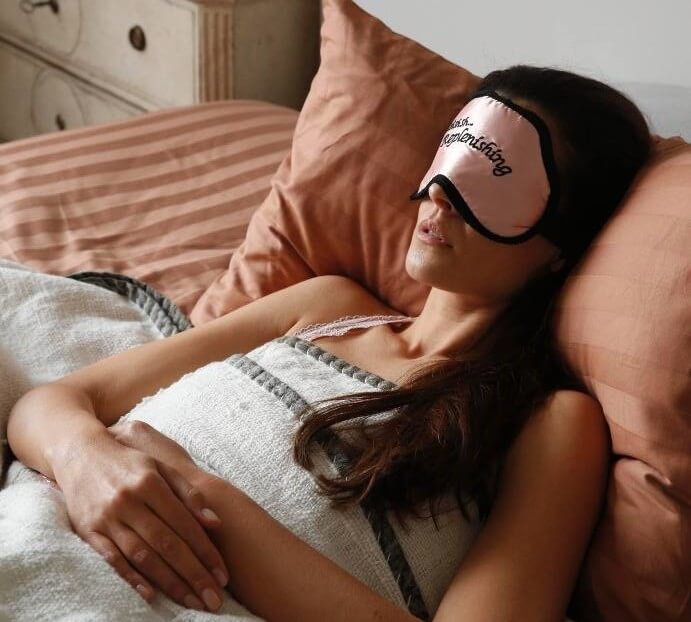 Women wearing pink colour eye mask