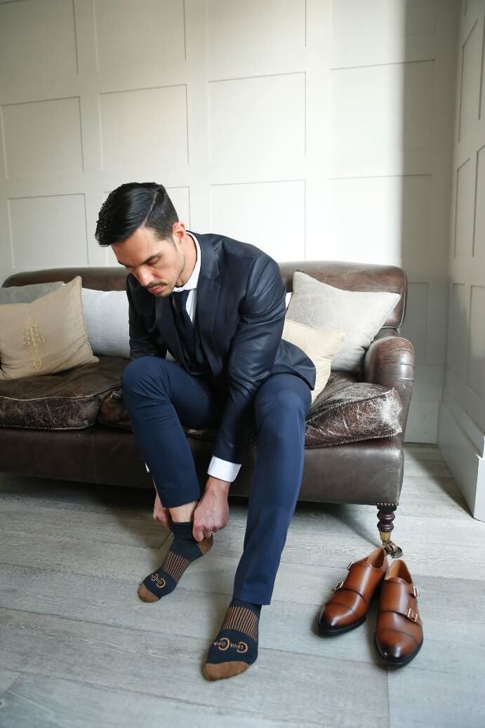 Men wearing copper socks and brown leather shoes